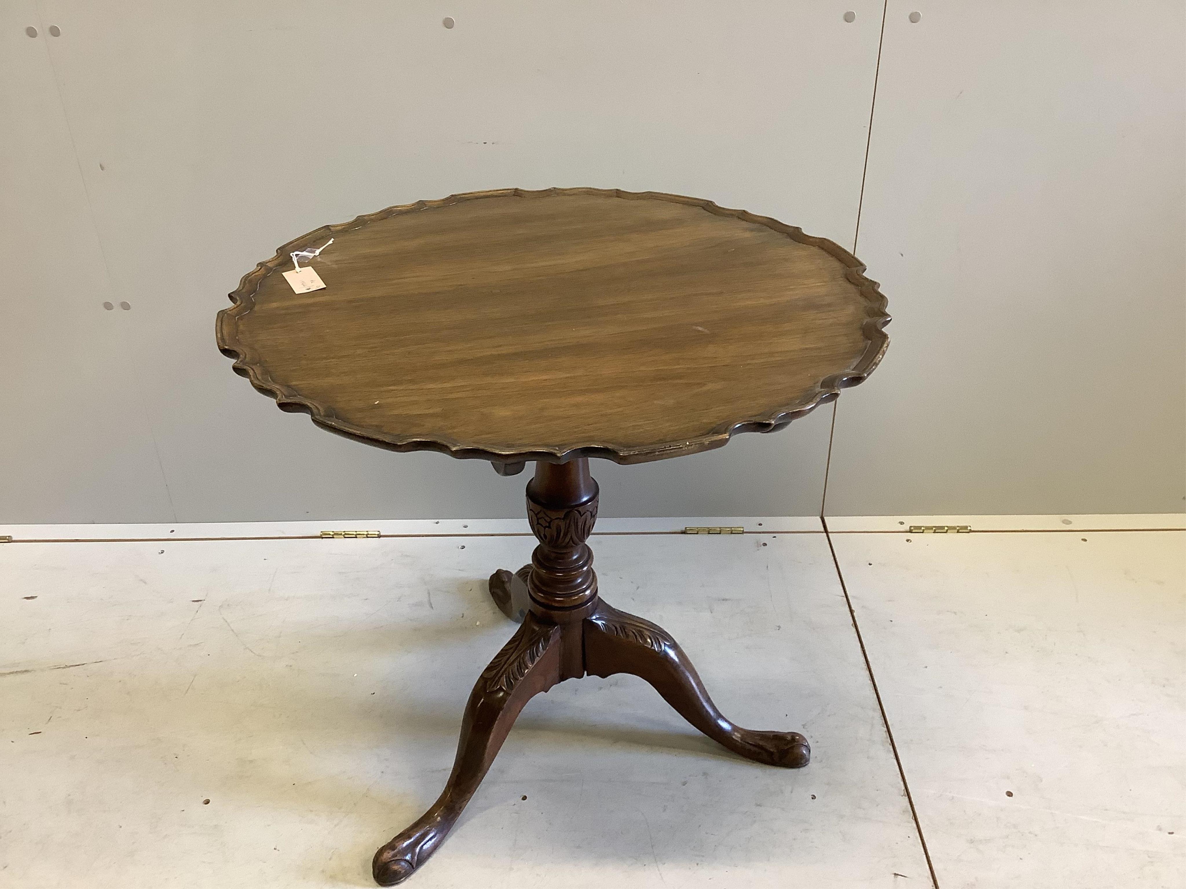 A Georgian style mahogany pie crust tripod table, width 75cm, height 72cm. Condition - fair, top a little faded